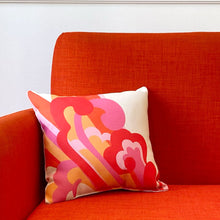 Fibbage 3 pillow on an orange chair